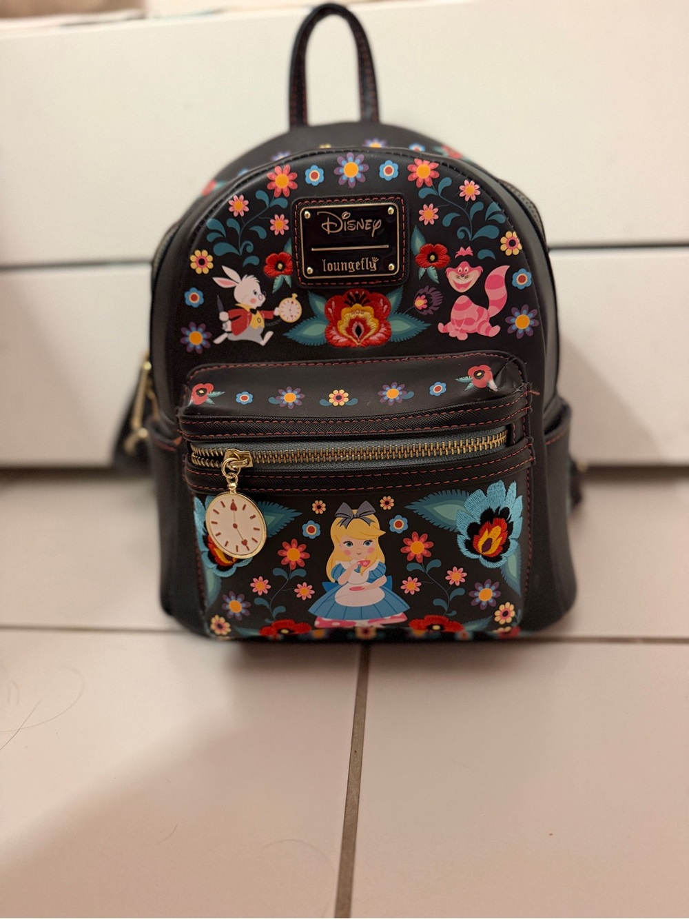 Loungefly Black Alice in Wonderland Floral Mini Backpack with Colorful Prints